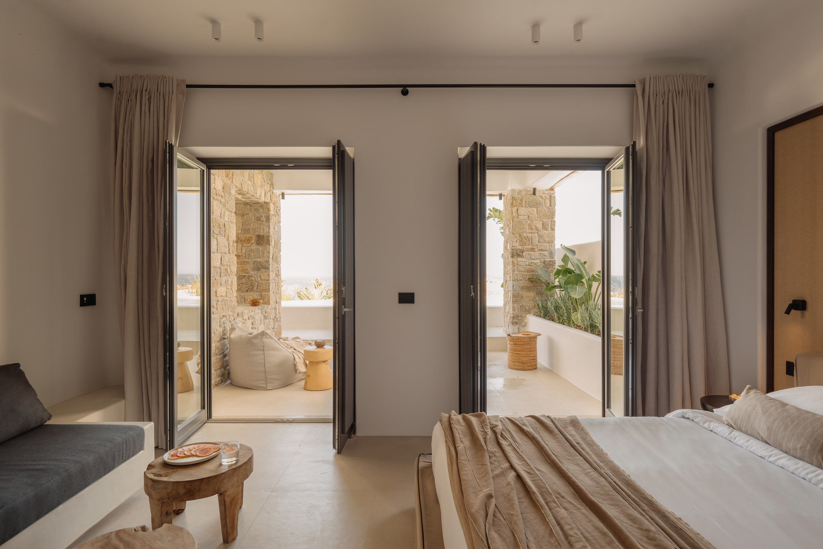 A Bard de Sol room with doors opening onto its terrace