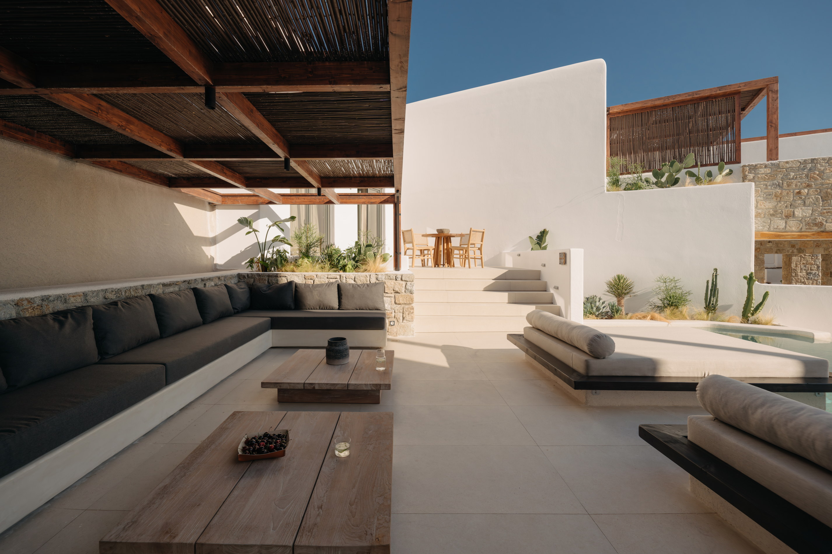 An outdoor lounge area at Bard de Sol looking towards the sea