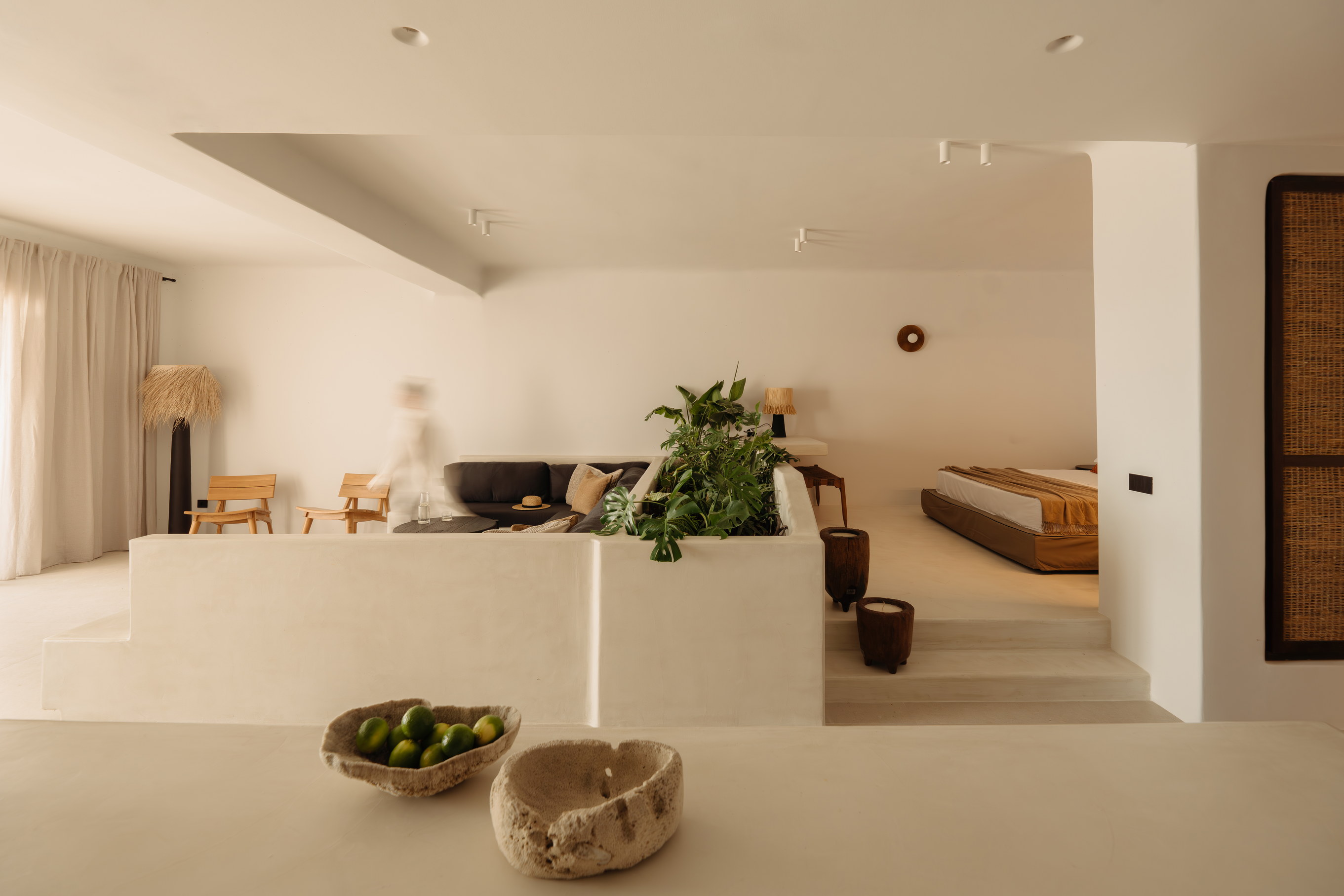 An open-plan Bard de Sol suite with the bed facing the terrace and the sea